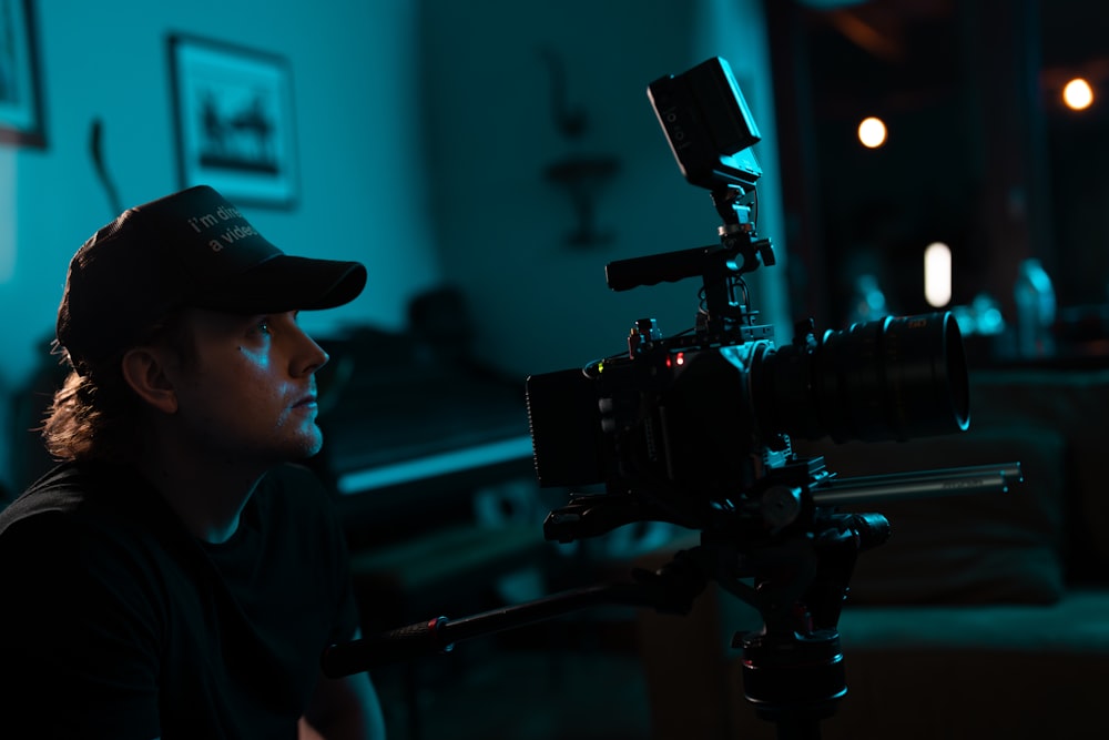 a man sitting in front of a camera in a living room