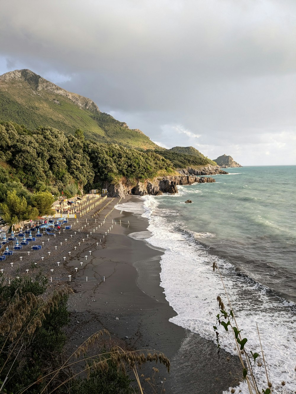 a beach with a bunch of chairs on it