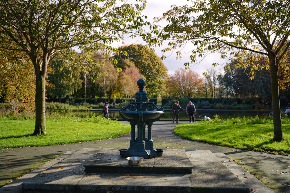a fountain in the middle of a park
