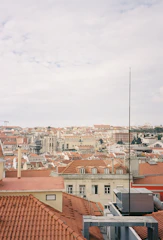 A panoramic view of city rooftops with digital network lines overlay.