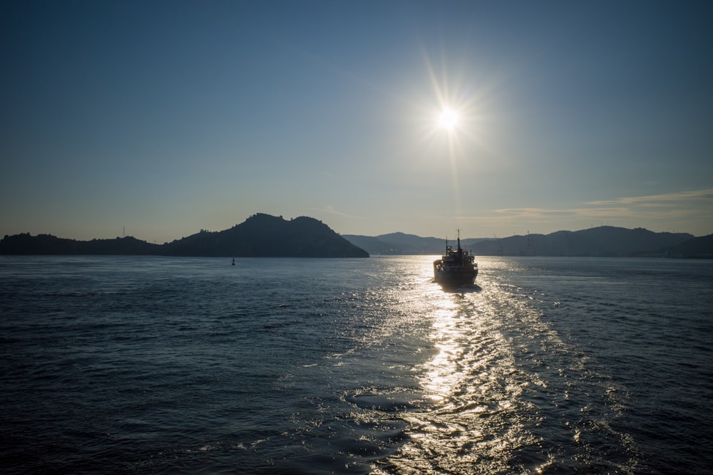 a boat traveling across a large body of water