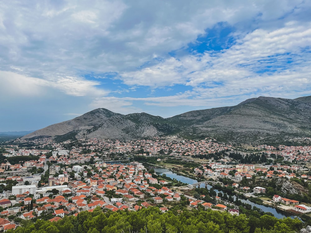 a view of a city with mountains in the background