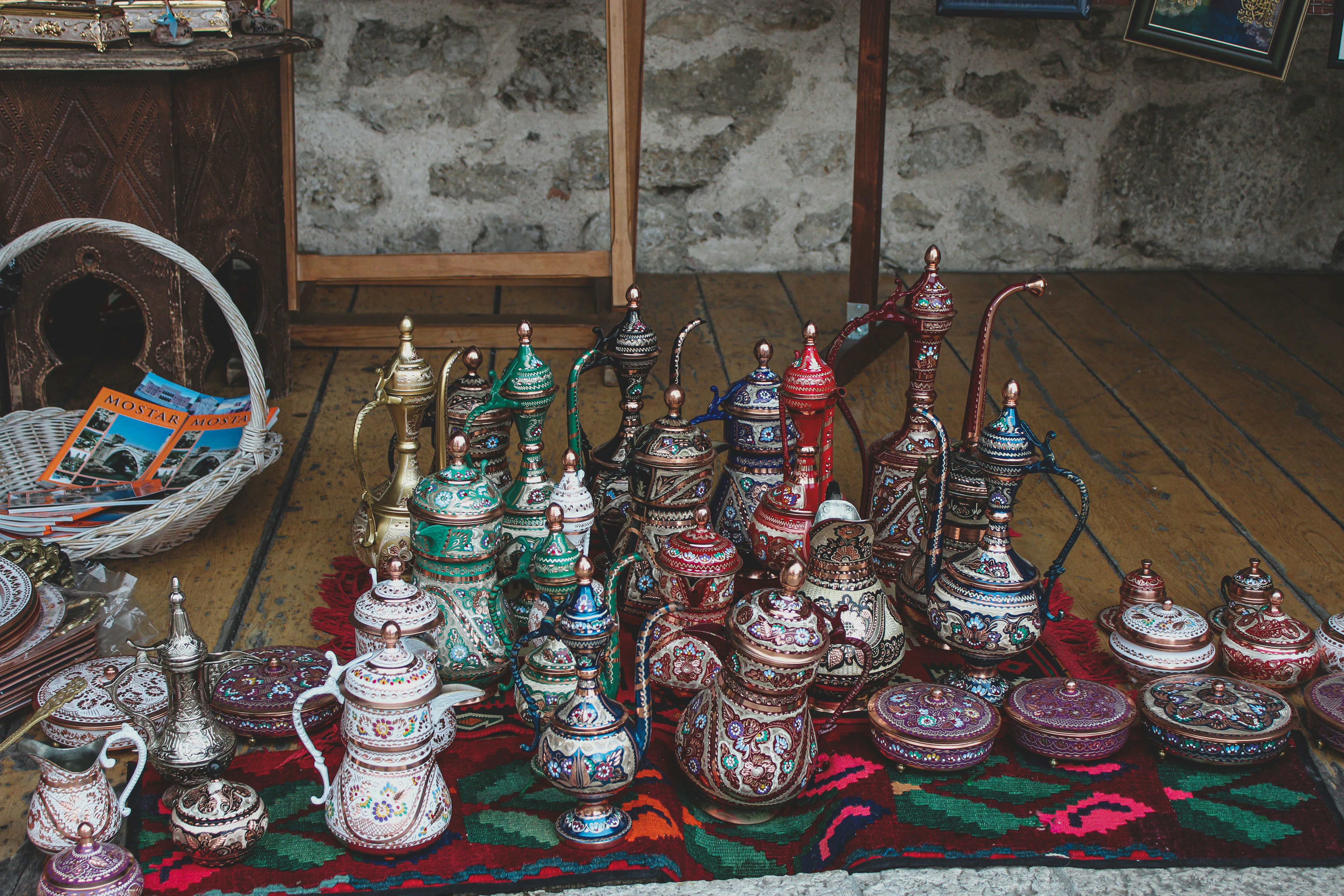 a collection of teapots on a rug in a room