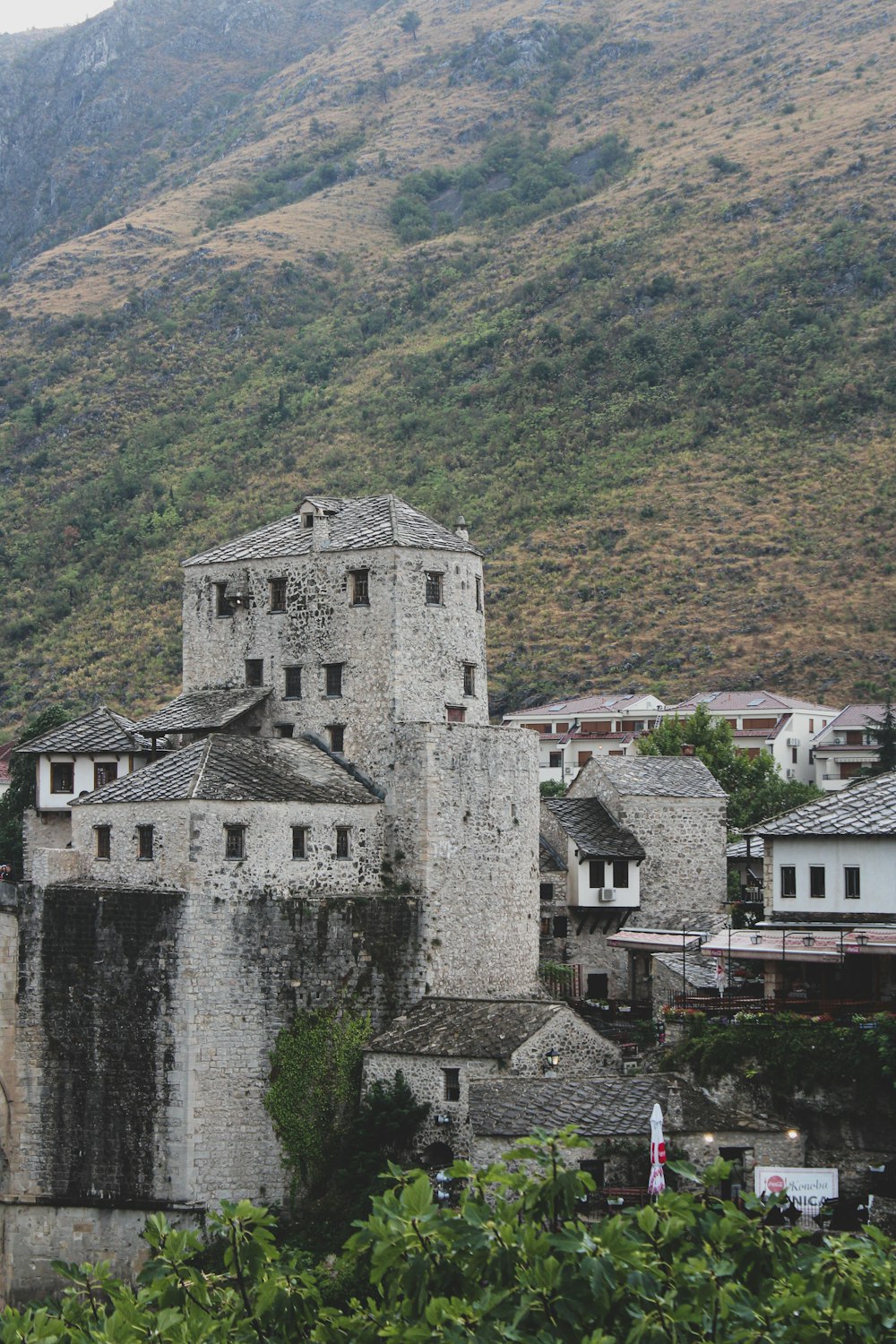 a castle like structure with a mountain in the background