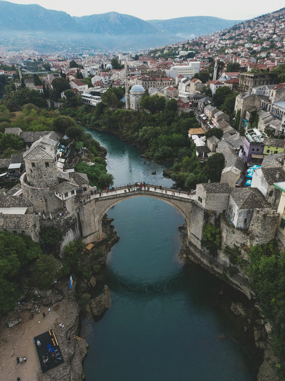 an aerial view of a bridge over a river