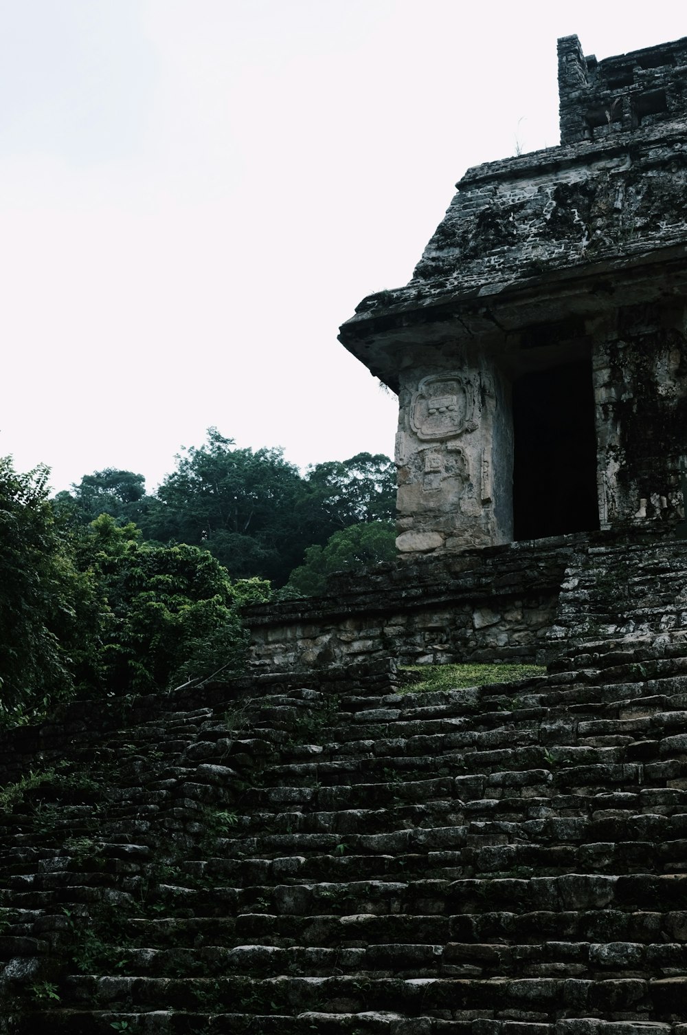 a stone structure with a window in the middle of it