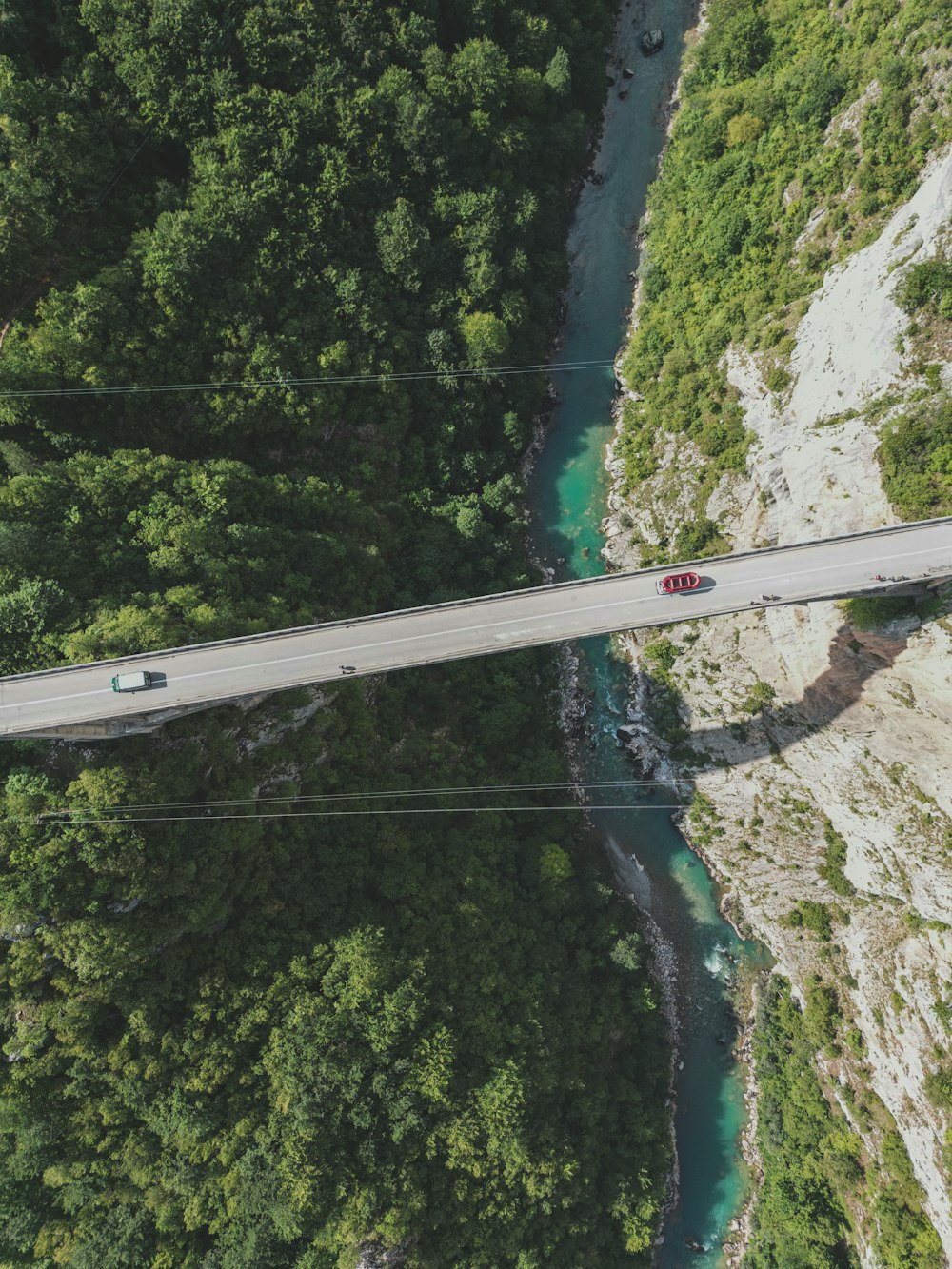 an aerial view of a bridge over a river