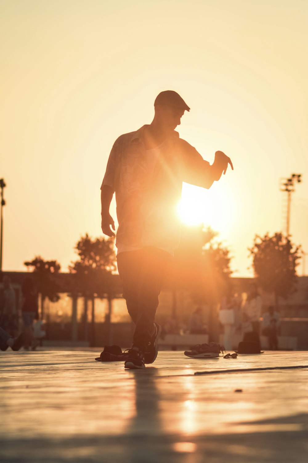 a man riding a skateboard across a parking lot