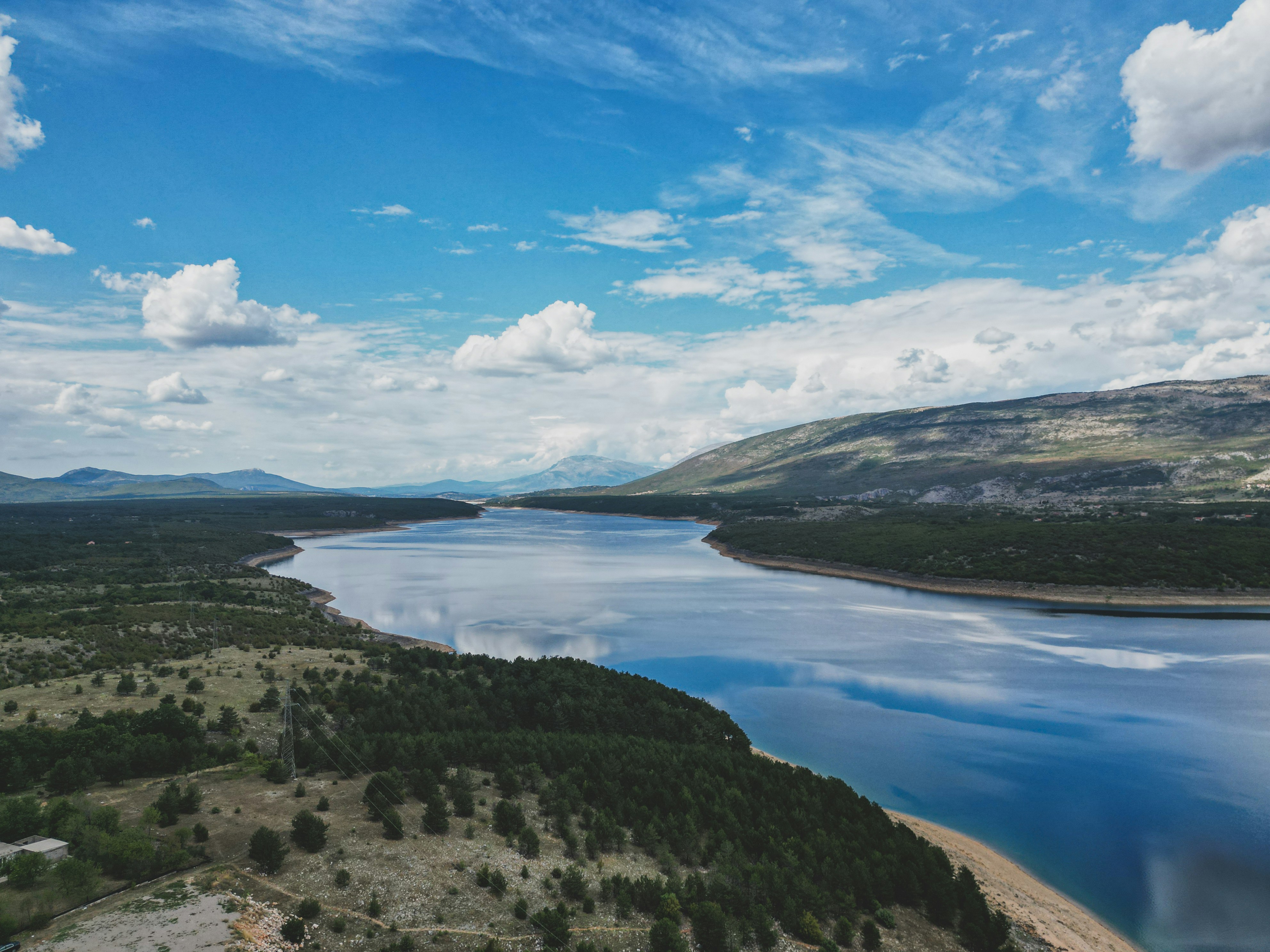 A large body of water surrounded by mountains