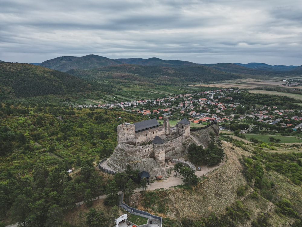 an aerial view of a castle on a hill