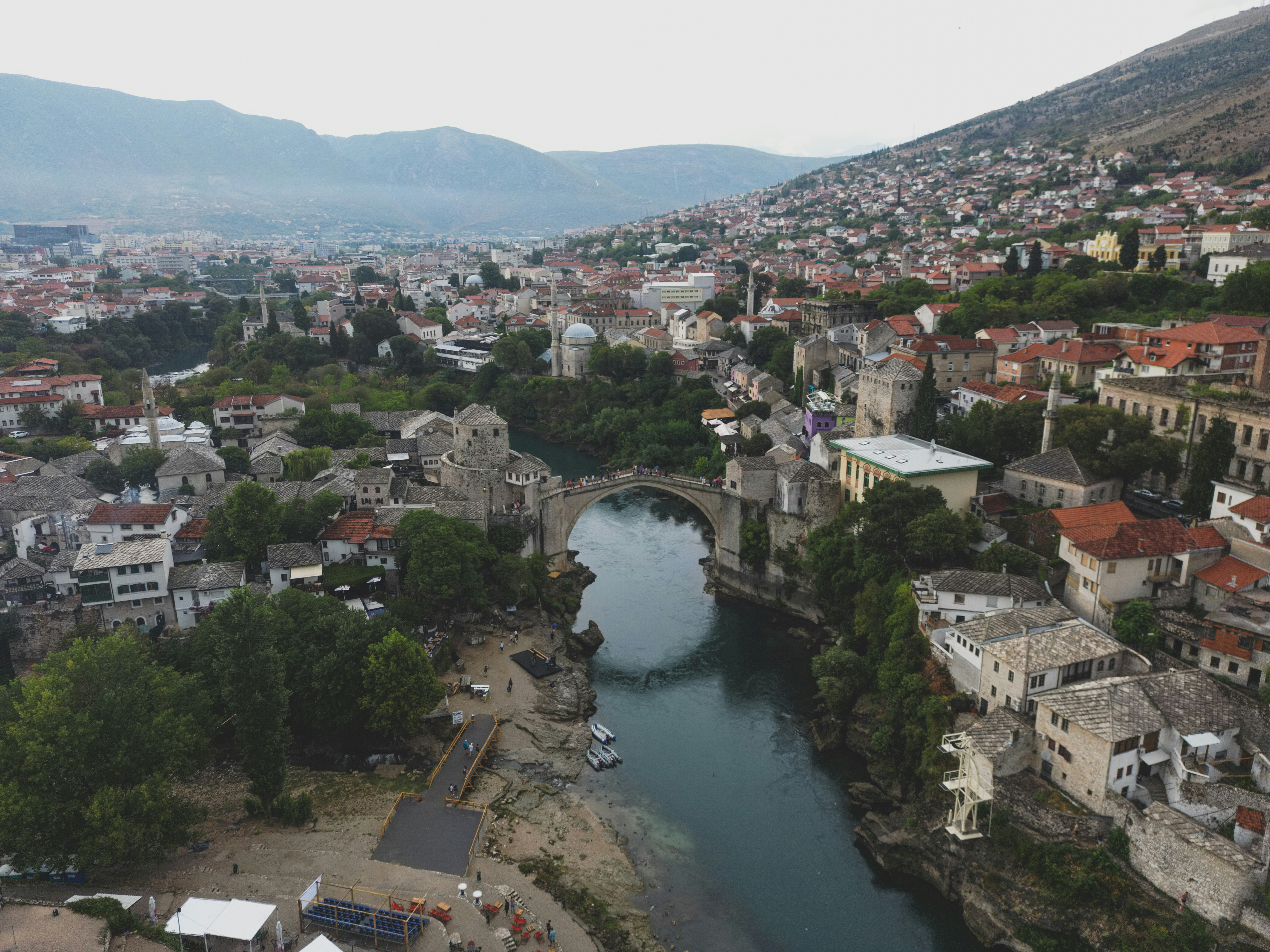 a river running through a city next to a bridge
