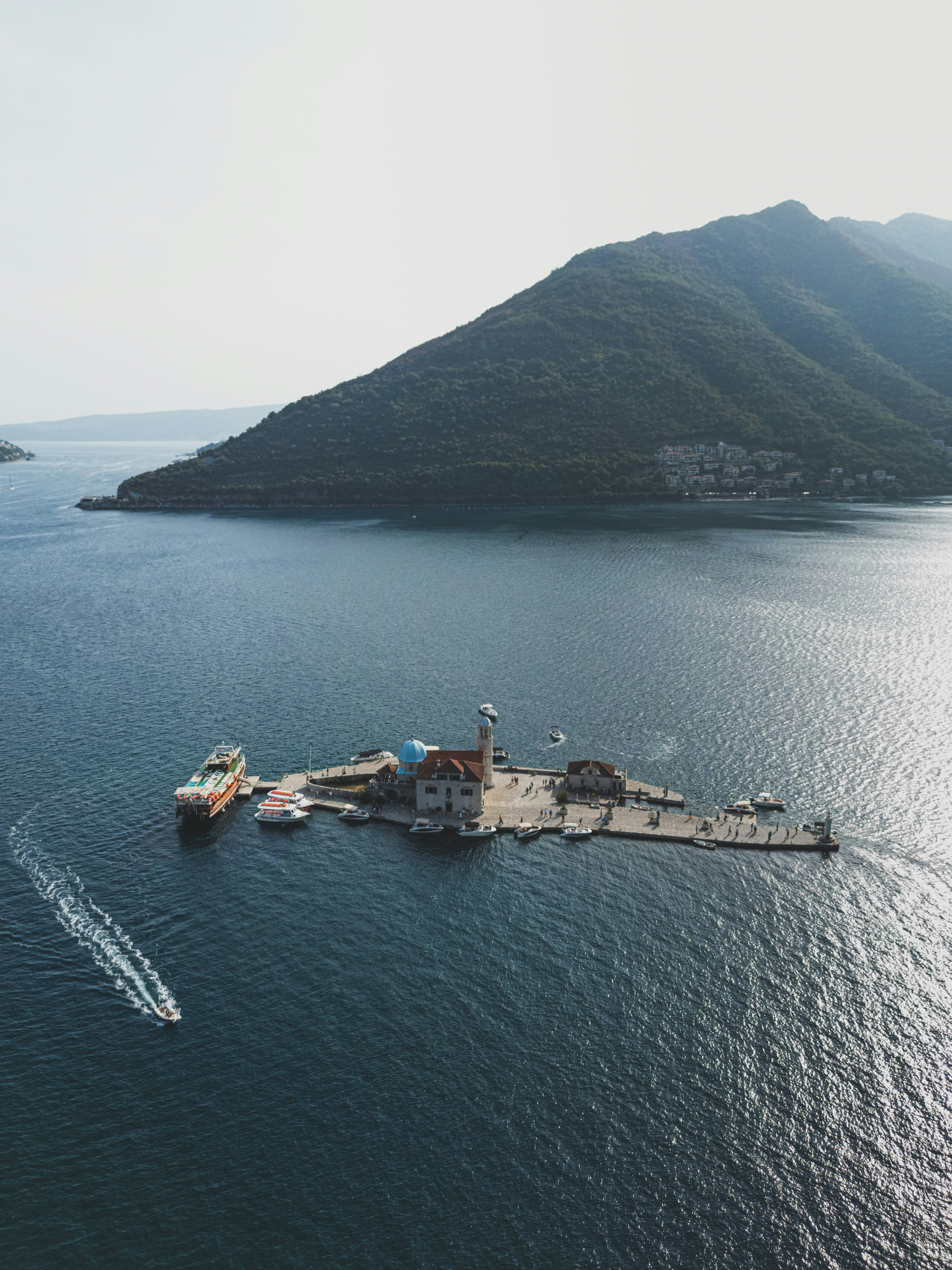 a large body of water with a boat in it