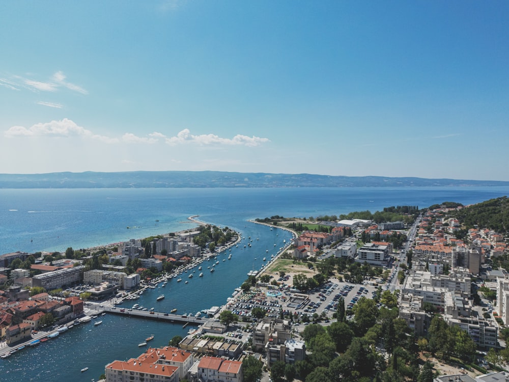 an aerial view of a city and a body of water