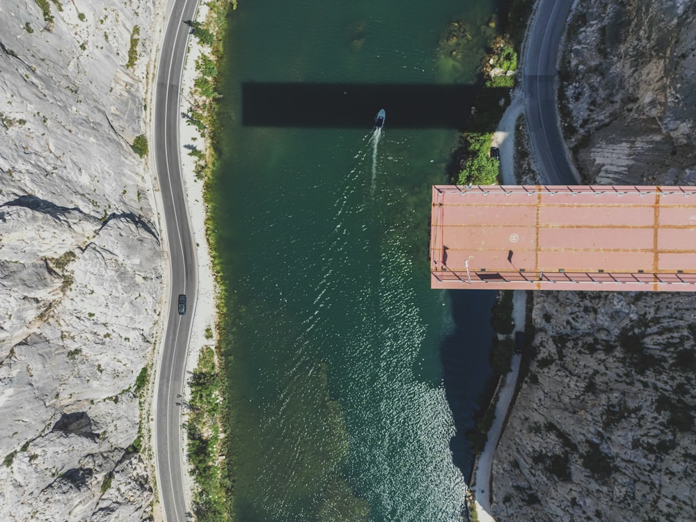 an aerial view of a bridge over a body of water