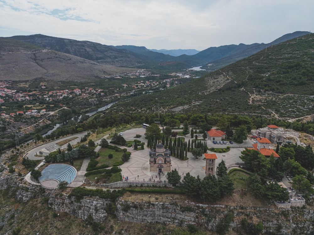 a bird's eye view of a scenic area with mountains in the background