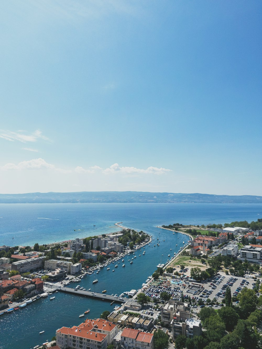 an aerial view of a harbor with boats in the water