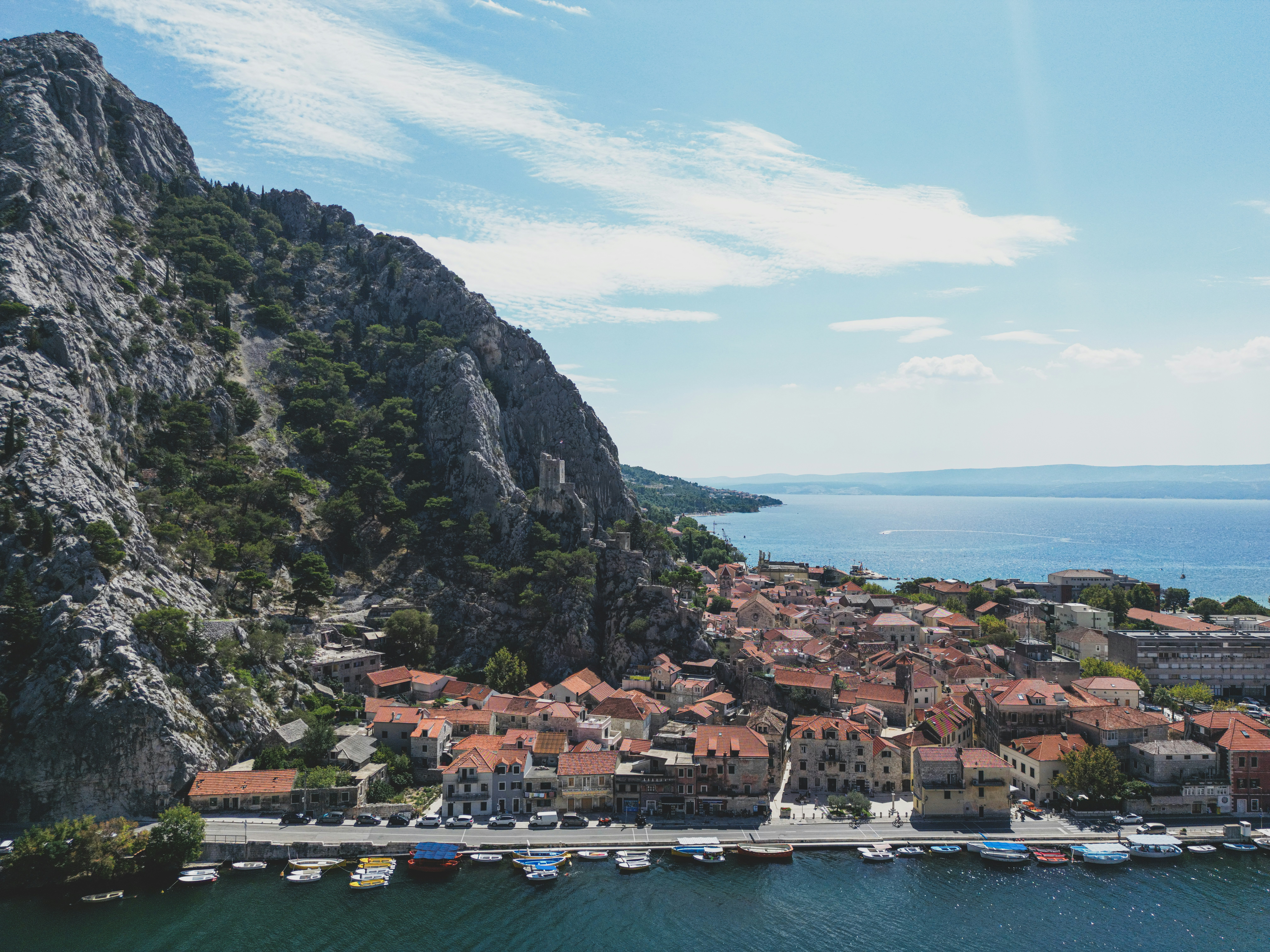 An aerial view of a small village on a cliff
