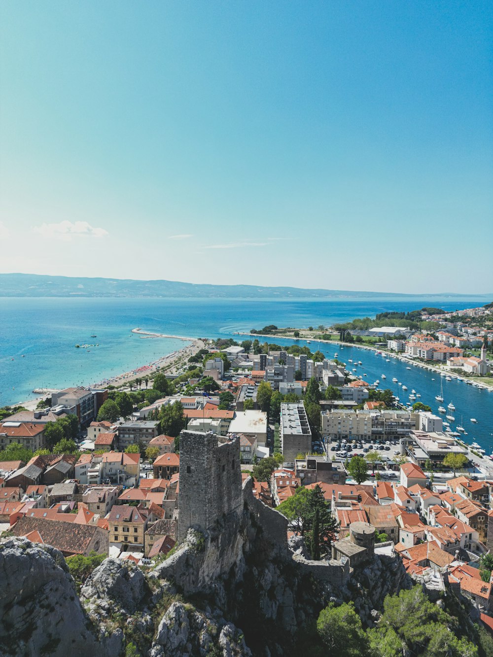 an aerial view of a city and a body of water