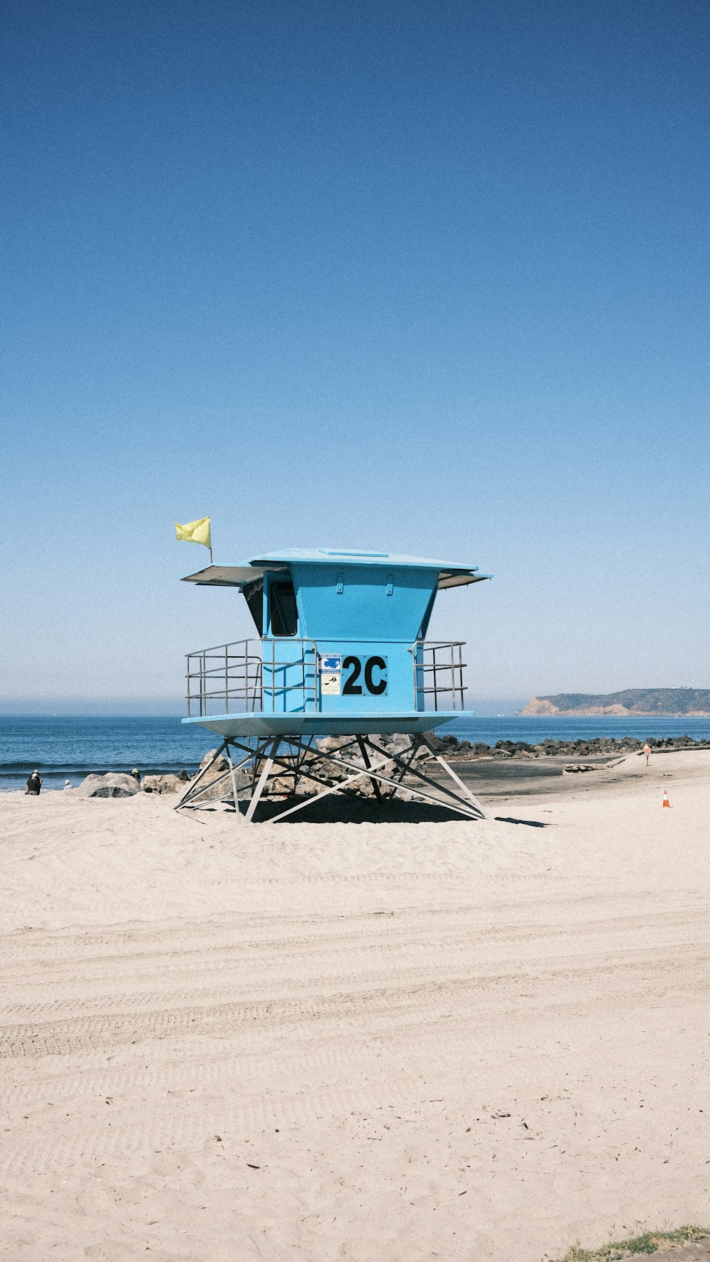 a lifeguard tower on a beach near the ocean