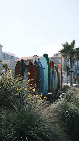 A vibrant surf scene capturing colorful surfboards on the beach.