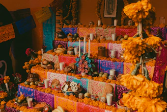 a display of skulls, candles, and decorations