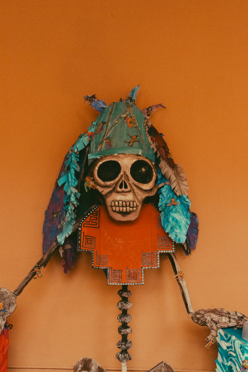 a clock with a skeleton wearing a headdress