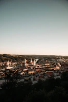 A panoramic view of a historic European town with cobblestone streets.