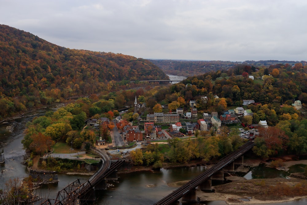 an aerial view of a town surrounded by trees