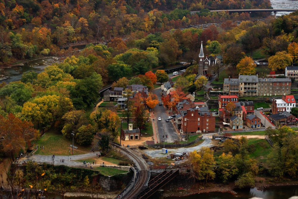 an aerial view of a town surrounded by trees