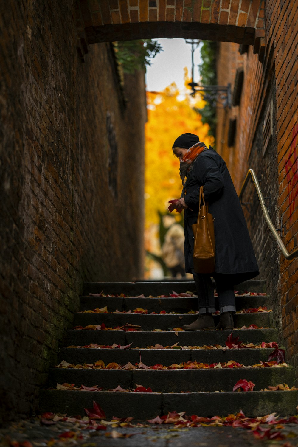 a woman walking down a flight of stairs