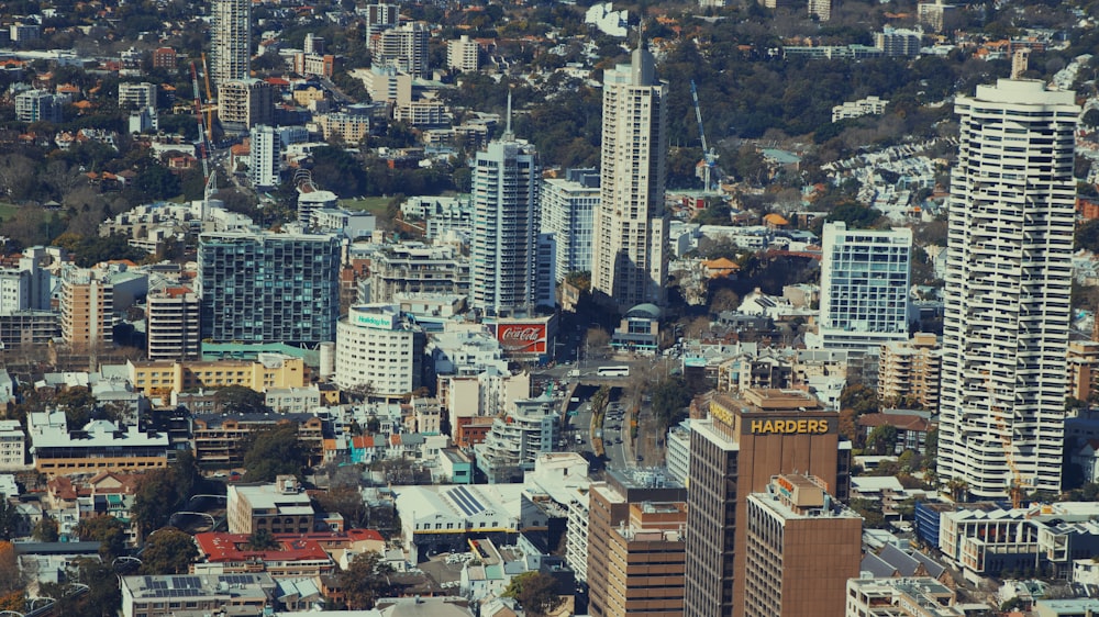 an aerial view of a city with tall buildings