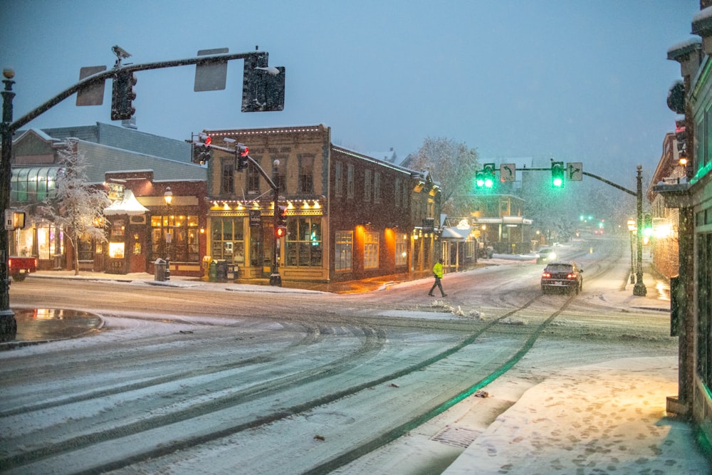 a city street with snow on the ground