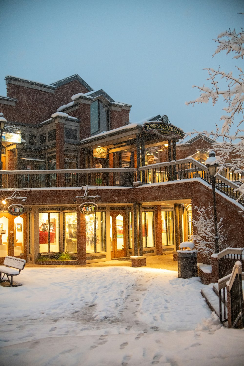 a large building with a lot of windows covered in snow