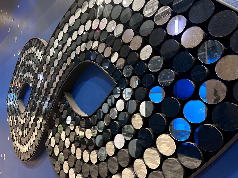 a large metal sculpture with many circles on it