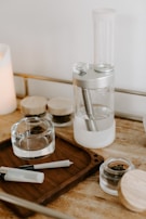 A sleek, modern smoking accessory set arranged artfully on a rustic wooden table.