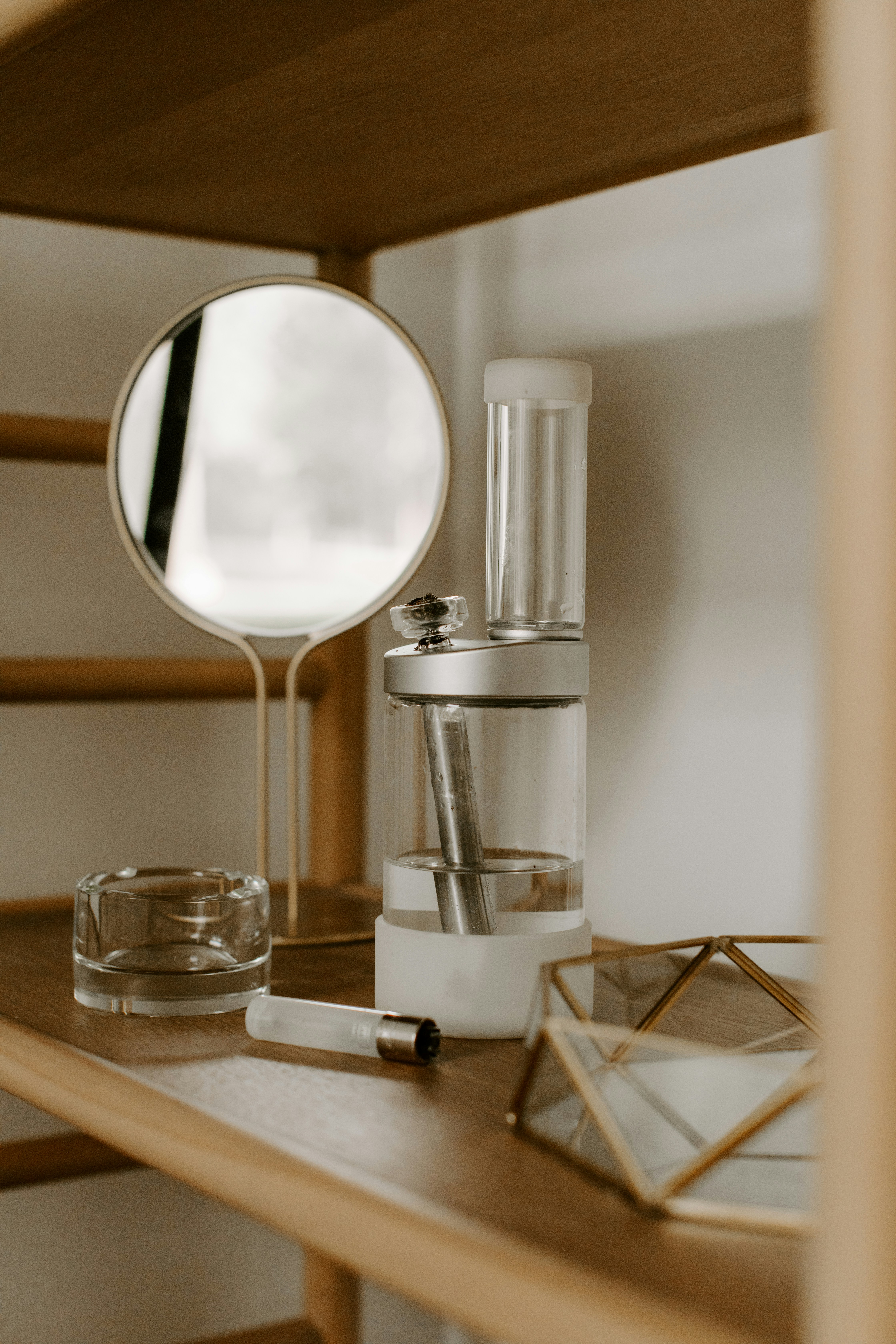 a blender sitting on top of a wooden shelf