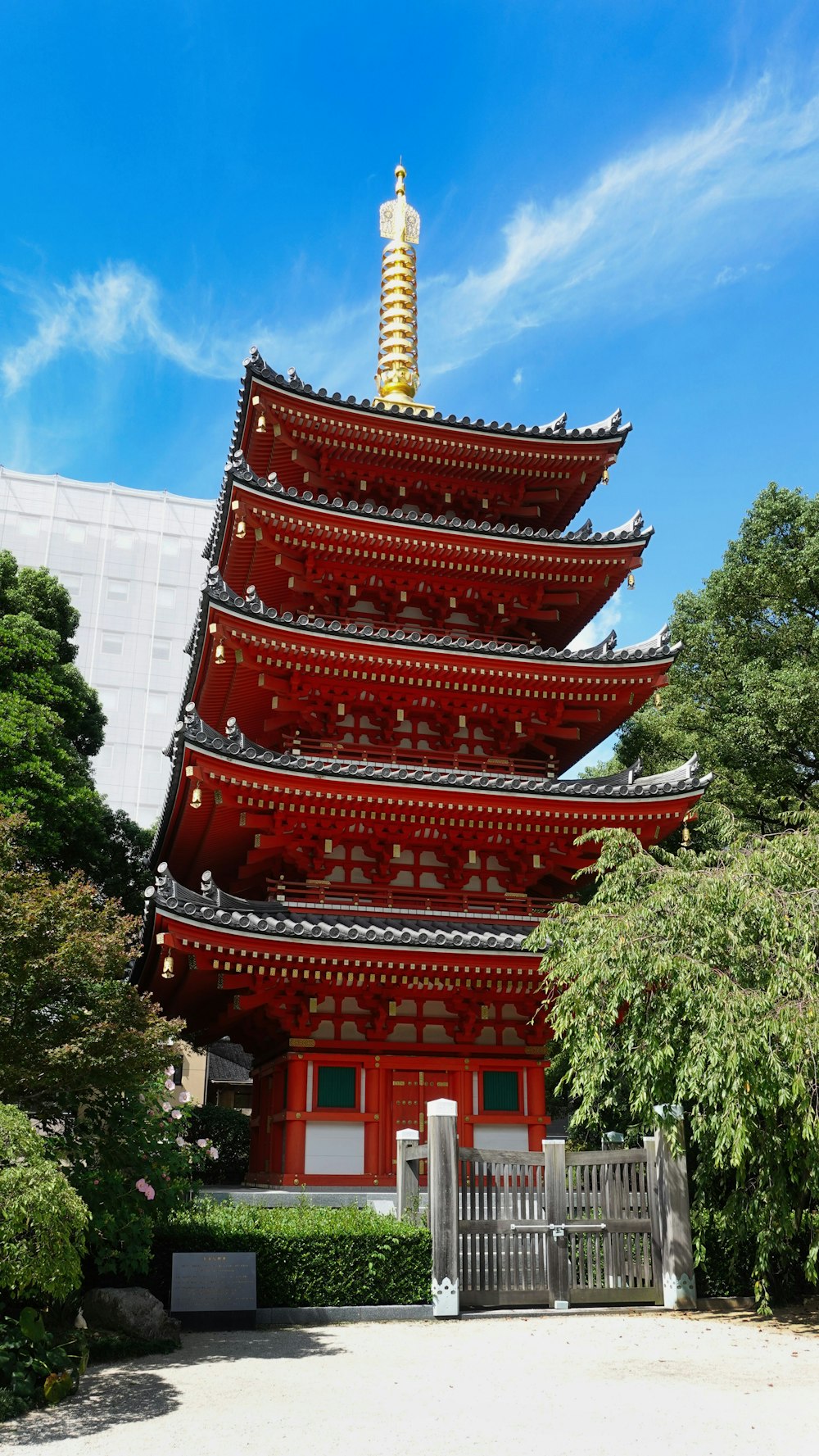 a tall red building with a tall tower on top of it