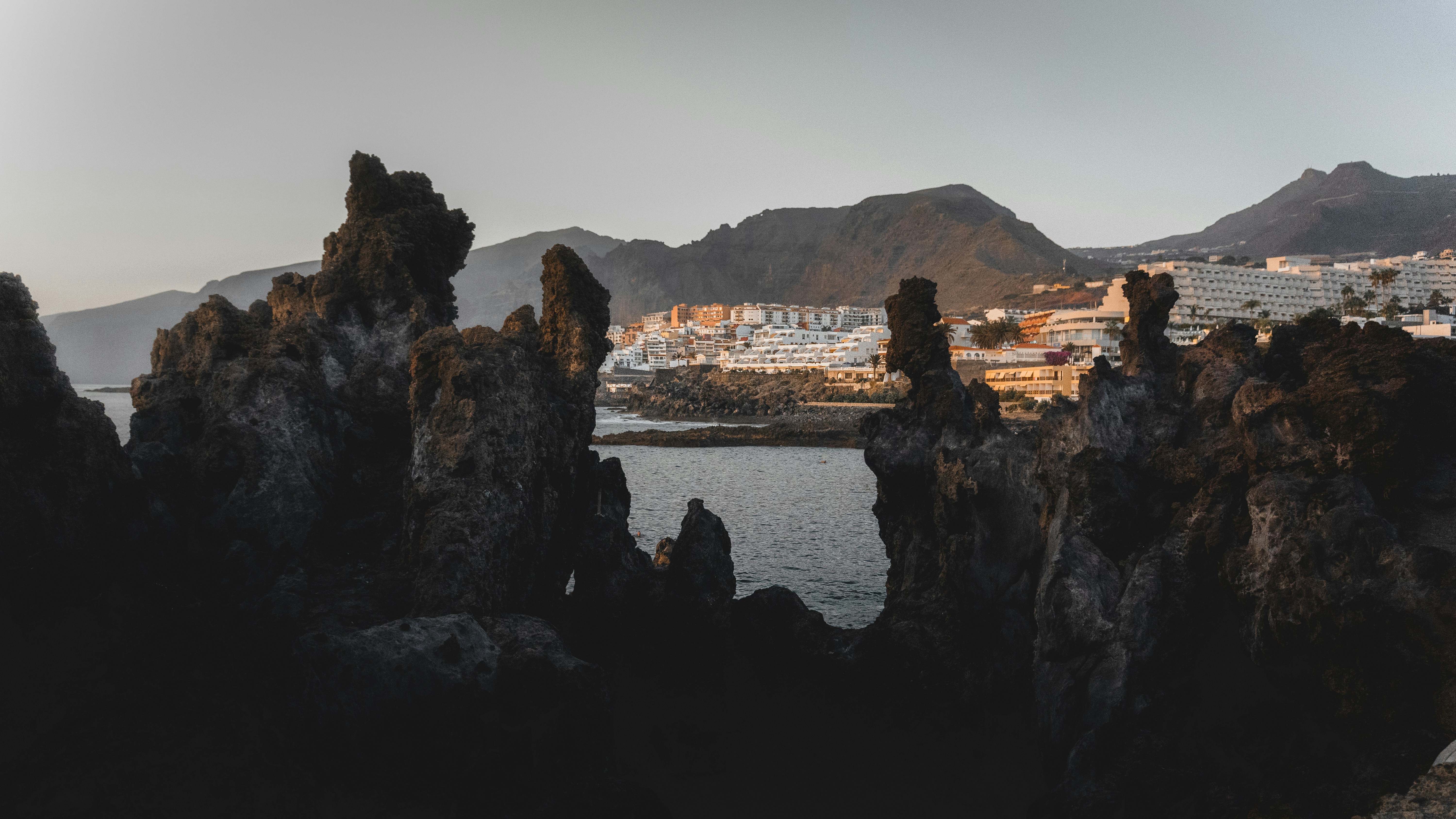 a view of a body of water with mountains in the background