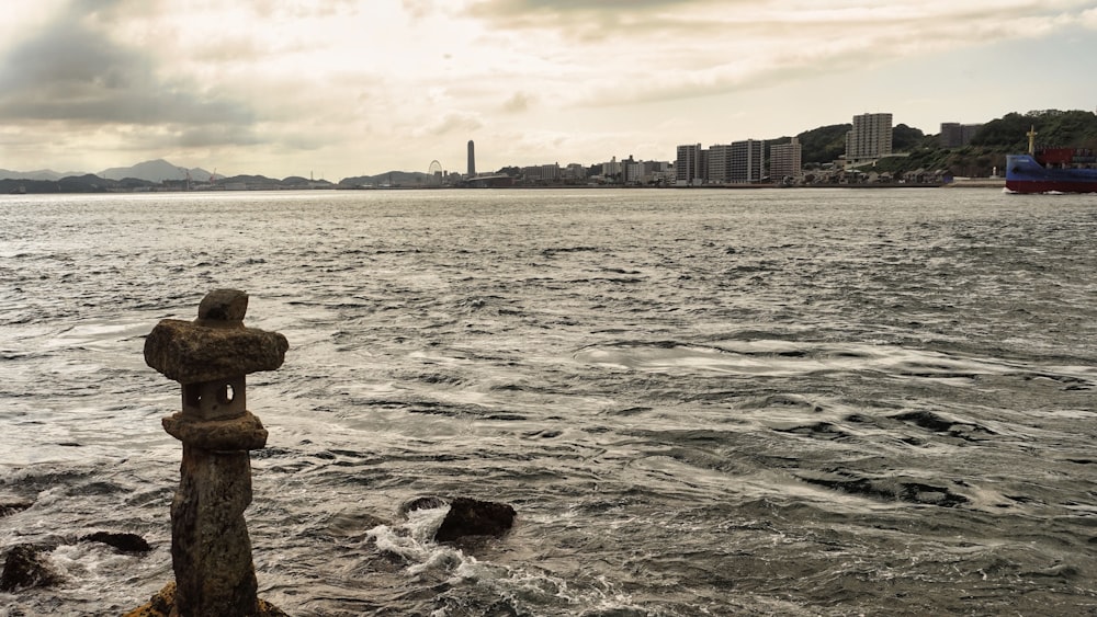 a view of a body of water with buildings in the background