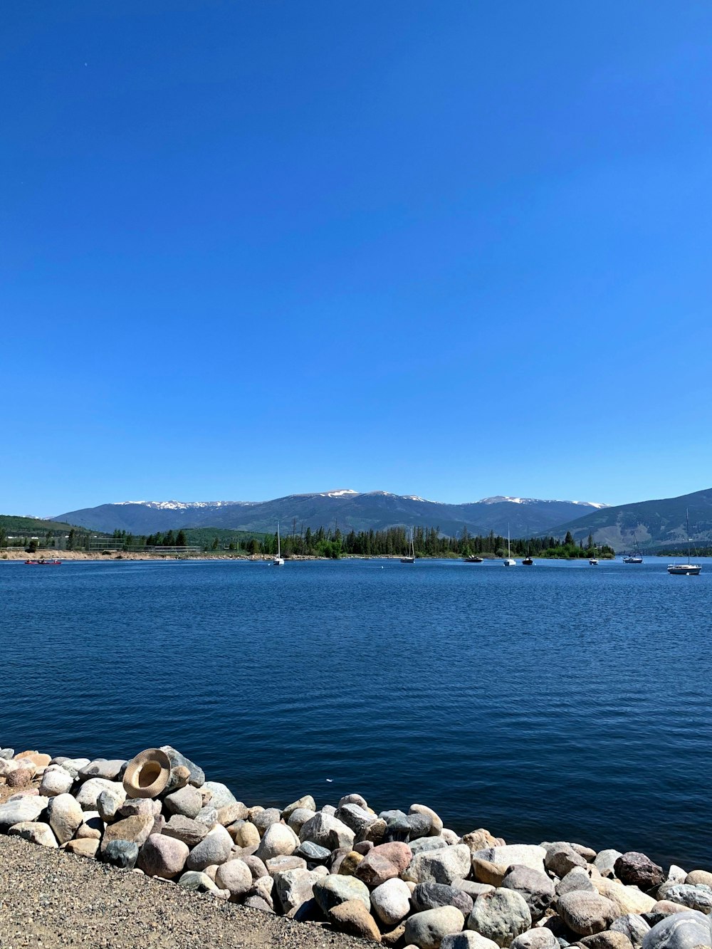 a view of a body of water with mountains in the background