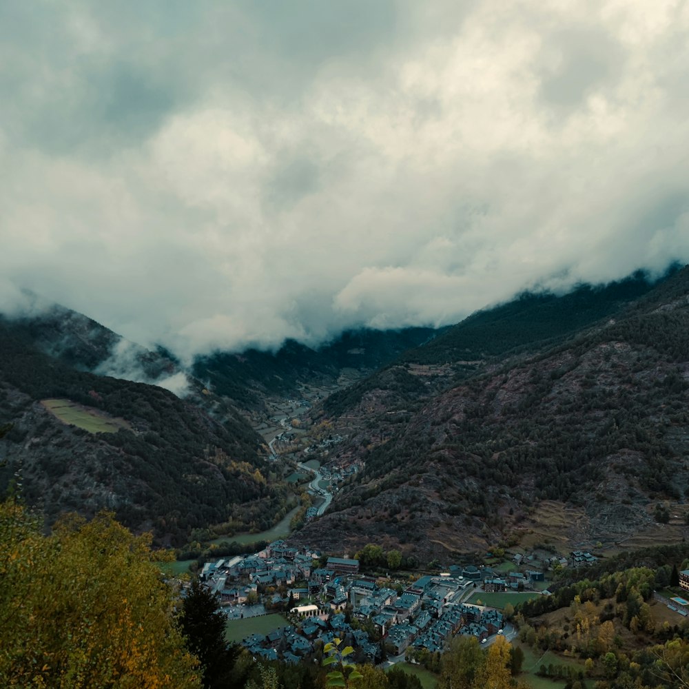 a view of a small town nestled in the mountains