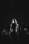 Black and white photograph of a theatrical performance in progress.