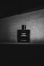 a bottle of perfume sitting on top of a table
