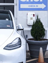 A friendly customer service representative ready to assist with electric vehicle battery test bookings.