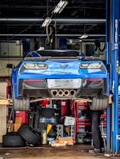 a man working on a car in a garage