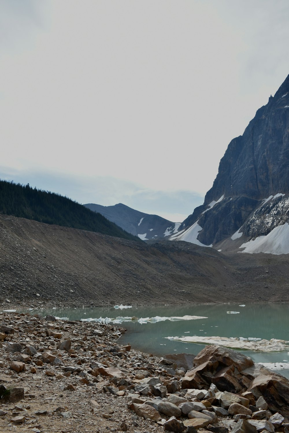 a mountain with a lake in the middle of it