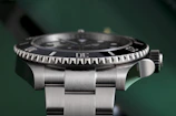 Side view of a Swiss watch showcasing its finely crafted bracelet and sapphire crystal.