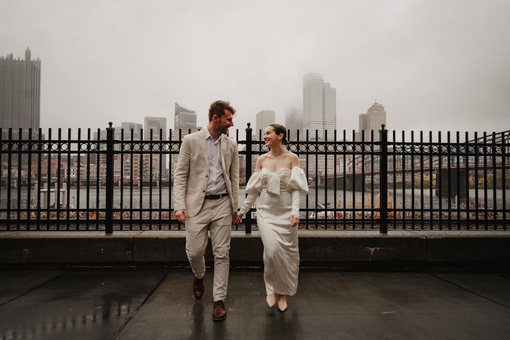 a man and a woman walking in the rain