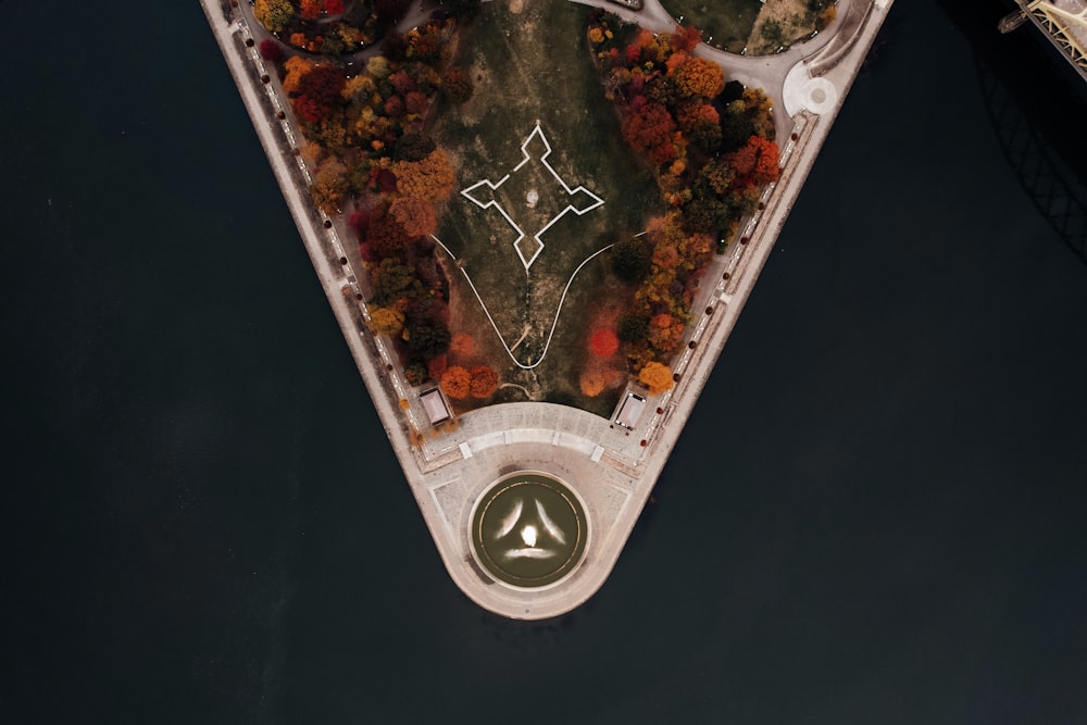 an aerial view of a boat in a body of water