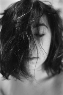 A moody black-and-white portrait of the lead singer, eyes closed, lost in the music.